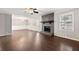Spacious living room featuring hardwood floors and a stone fireplace at 1152 Bailing Dr, Lawrenceville, GA 30043