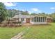 Spacious backyard features a deck, screened-in porch and beautiful garden bed, perfect for outdoor living and entertaining at 5306 Corinth Cir, Stone Mountain, GA 30087