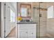 Updated bathroom featuring granite countertops and a tiled shower with glass door at 5306 Corinth Cir, Stone Mountain, GA 30087