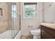 Neutral bathroom features a tiled shower-tub combo and vanity with a marble countertop at 5306 Corinth Cir, Stone Mountain, GA 30087