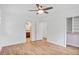 Spacious bedroom with light wood floors, connecting to a bathroom and closet, providing comfort and functionality at 5306 Corinth Cir, Stone Mountain, GA 30087