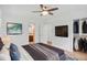 Serene bedroom featuring modern decor, a mounted TV, walk-in closet, and en-suite bathroom, offering comfort and convenience at 5306 Corinth Cir, Stone Mountain, GA 30087