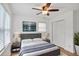 Cozy bedroom offering a comfortable bed, mounted TV, and natural light, creating a serene and inviting space to rest and unwind at 5306 Corinth Cir, Stone Mountain, GA 30087
