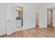 Spacious bedroom with wood flooring and easy access to the bathroom, creating a functional and comfortable space at 5306 Corinth Cir, Stone Mountain, GA 30087