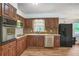 Well-equipped kitchen with stainless steel appliances, granite countertops, and ample storage, ideal for culinary enthusiasts at 5306 Corinth Cir, Stone Mountain, GA 30087