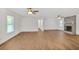 Expansive living area featuring wood-look flooring, neutral walls, and a charming fireplace, great for gatherings and relaxation at 5306 Corinth Cir, Stone Mountain, GA 30087