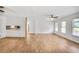 Bright, open living room with wood-look floors, ceiling fan, and natural light, ideal for comfortable living and entertaining at 5306 Corinth Cir, Stone Mountain, GA 30087