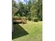 Well-maintained backyard with a wooden deck and lush green lawn at , Covington, GA 30014