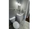 Cozy bathroom with decorative mirror and tiled floors at , Covington, GA 30014