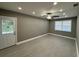 Bedroom featuring tile floors, white trim, and an exit door to the backyard at , Covington, GA 30014