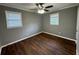 Comfortable bedroom featuring natural light, ceiling fan and hardwood floors at , Covington, GA 30014