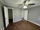 Bedroom with hardwood flooring and multiple entryways at , Covington, GA 30014