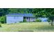 Charming single-story home with a covered front porch, nestled amongst lush greenery at , Covington, GA 30014