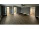 Large living room featuring hardwood floors, ceiling fan, and multiple entryways at , Covington, GA 30014