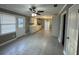 Open-concept living room boasts large windows, neutral paint, and modern tile floors at , Covington, GA 30014