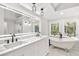 Bright bathroom with double vanity, soaking tub, walk-in shower, and nature views at 100 Little Ridge Rd, Berkeley Lake, GA 30096
