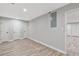 Neutral bedroom offers wood-look flooring, and ample closet space at 100 Little Ridge Rd, Berkeley Lake, GA 30096