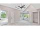 Bedroom with vaulted ceiling, a ceiling fan, closet and windows with a view of the trees at 100 Little Ridge Rd, Berkeley Lake, GA 30096
