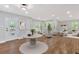 Bright living room featuring hardwood floors, neutral furniture and a decorative front door at 100 Little Ridge Rd, Berkeley Lake, GA 30096