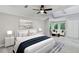 Main bedroom with luxury carpet, sitting area, and abundant natural light at 100 Little Ridge Rd, Berkeley Lake, GA 30096