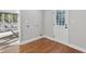 Mud room with a white door to the outside and an open door to a screened-in porch at 100 Little Ridge Rd, Berkeley Lake, GA 30096