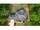 Aerial view of a home showing the well maintained roof and beautiful landscaping at 1080 Gaithers Rd, Mansfield, GA 30055