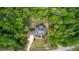 Beautiful aerial view of the home situated among the surrounding lush, green trees at 1080 Gaithers Rd, Mansfield, GA 30055