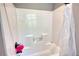 Classic white bathtub and shower combination with updated fixtures at 1080 Gaithers Rd, Mansfield, GA 30055