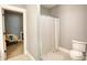 Bright bathroom featuring tile floors, a shower with a white curtain, and neutral walls at 1080 Gaithers Rd, Mansfield, GA 30055