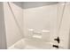 Clean white tub and shower with modern, updated fixtures at 1080 Gaithers Rd, Mansfield, GA 30055