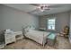 Serene bedroom with neutral color scheme and bright natural light from the windows at 1080 Gaithers Rd, Mansfield, GA 30055