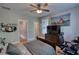 Nicely decorated bedroom with a ceiling fan and wall decor at 1080 Gaithers Rd, Mansfield, GA 30055