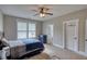 Comfortable bedroom featuring a ceiling fan and well-lit windows at 1080 Gaithers Rd, Mansfield, GA 30055
