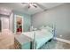 Comfortable bedroom with ceiling fan, carpet and connected closet at 1080 Gaithers Rd, Mansfield, GA 30055