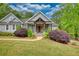 Inviting home with lush greenery and a charming front porch area at 1080 Gaithers Rd, Mansfield, GA 30055