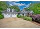 Charming home featuring an attached two-car garage and a well-manicured lawn at 1080 Gaithers Rd, Mansfield, GA 30055