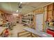 Spacious garage featuring a lot of storage and shelving; a versatile space for projects and organization at 1080 Gaithers Rd, Mansfield, GA 30055