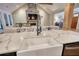 Kitchen island featuring a white farmhouse sink, stainless steel dishwasher and quartz countertops at 1080 Gaithers Rd, Mansfield, GA 30055