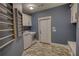 Well-appointed laundry room with ample cabinet space and laundry rack at 1080 Gaithers Rd, Mansfield, GA 30055