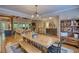 Open floor plan showcases dining area, living room, and a stone fireplace for a cozy feel at 1080 Gaithers Rd, Mansfield, GA 30055