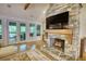 This spacious living room offers comfortable seating, a fireplace, and access to the patio at 1080 Gaithers Rd, Mansfield, GA 30055