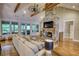 The living room features a stone fireplace, hardwood floors, and access to an outdoor patio at 1080 Gaithers Rd, Mansfield, GA 30055
