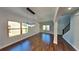 Well-lit dining area featuring modern lighting, hardwood floors, and stairway at 1280 Sw Vonda Ln, Mableton, GA 30126