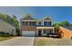 Charming brick two-story home featuring a two-car garage and a well-manicured lawn on a sunny day at 1280 Sw Vonda Ln, Mableton, GA 30126