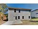 Rear exterior view of home with gray siding, a concrete patio, and well-placed windows for ample natural light at 1280 Sw Vonda Ln, Mableton, GA 30126