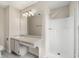 Bright bathroom offers a shower and vanity with a large mirror at 3476 Silver Maple Dr, Duluth, GA 30096