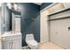 Functional bathroom with a toilet, vanity, and laundry hookups at 3476 Silver Maple Dr, Duluth, GA 30096