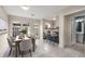 Bright dining area with backyard view, open to kitchen and next to a bathroom at 3476 Silver Maple Dr, Duluth, GA 30096