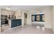 Open-concept kitchen featuring stainless steel appliances and a breakfast bar at 3476 Silver Maple Dr, Duluth, GA 30096