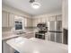 Kitchen features modern appliances, white cabinets, and bright countertops at 3476 Silver Maple Dr, Duluth, GA 30096